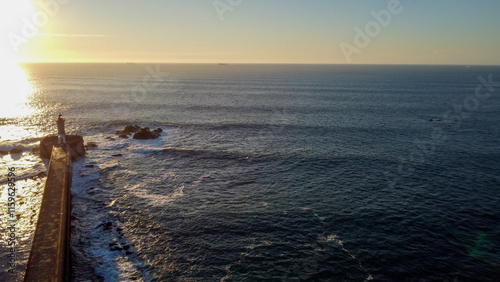 Vista capturando a deslumbrante paisagem do Porto e de Matosinhos, onde o Rio Douro encontra o Oceano Atlântico. A cena apresenta as areias douradas da praia de Matosinhos,  photo