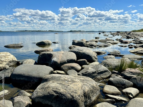 Beautiful scenery by the sea. A stony seaside on a wonderful, sunny summer day. The photo is taken in Kylmäpihlaja Iskand in Finland, which is a a part of the Bothnian Sea National Park. photo