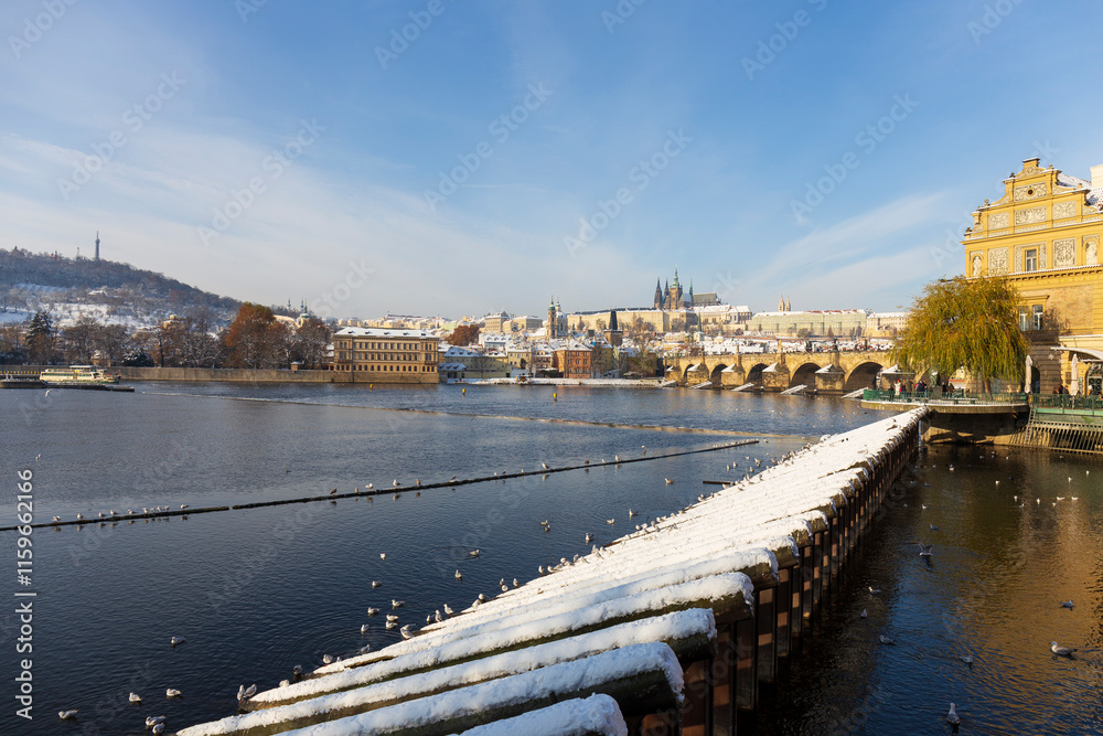 Snowy Prague Lesser Town with Prague Castle above River Vltava, Czech republic 
