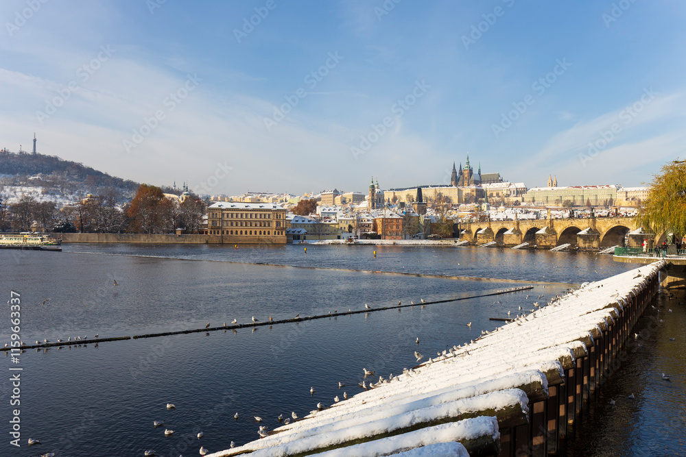 Snowy Prague Lesser Town with Prague Castle above River Vltava, Czech republic