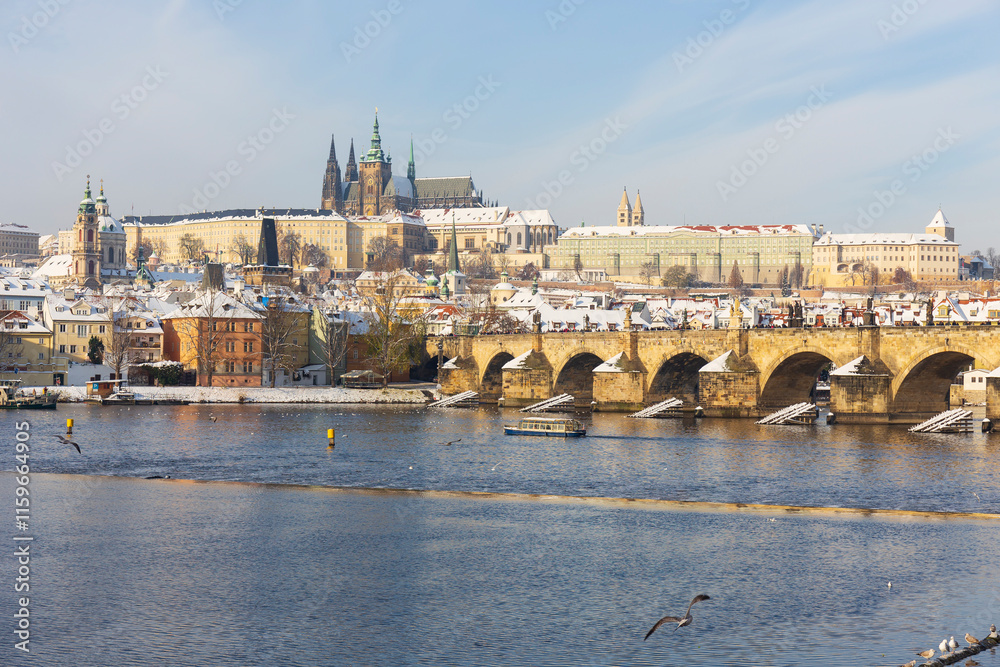 Snowy Prague Lesser Town with Prague Castle above River Vltava, Czech republic