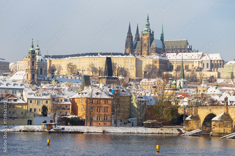 Snowy Prague Lesser Town with Prague Castle above River Vltava, Czech republic