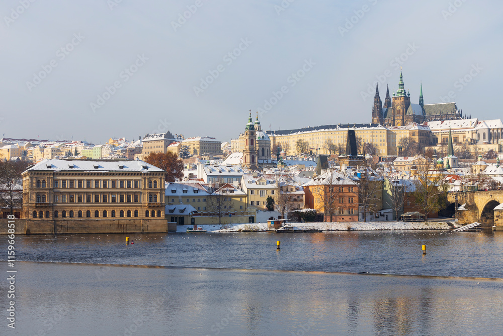 Snowy Prague Lesser Town with Prague Castle above River Vltava, Czech republic