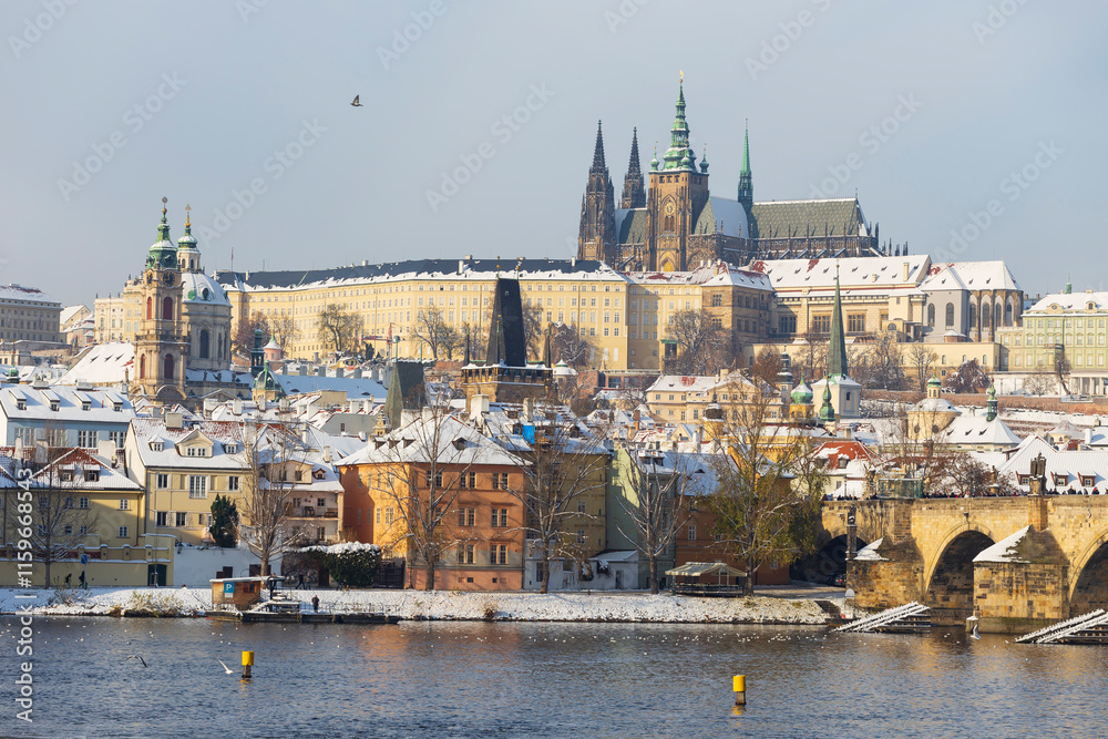 Snowy Prague Lesser Town with Prague Castle above River Vltava, Czech republic