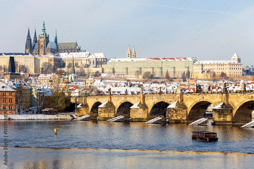 Snowy Prague Lesser Town with Prague Castle above River Vltava, Czech republic