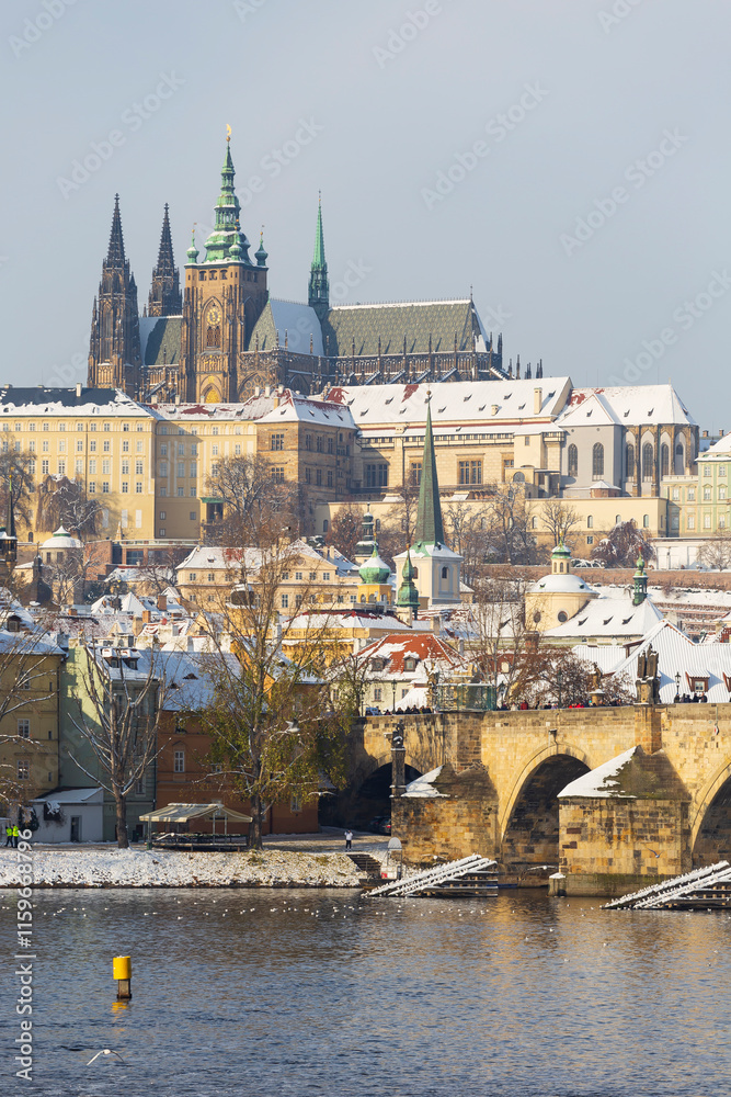 Snowy Prague Lesser Town with Prague Castle above River Vltava, Czech republic