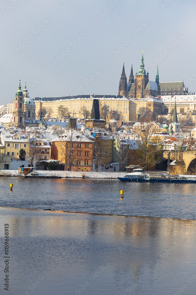 Snowy Prague Lesser Town with Prague Castle above River Vltava, Czech republic