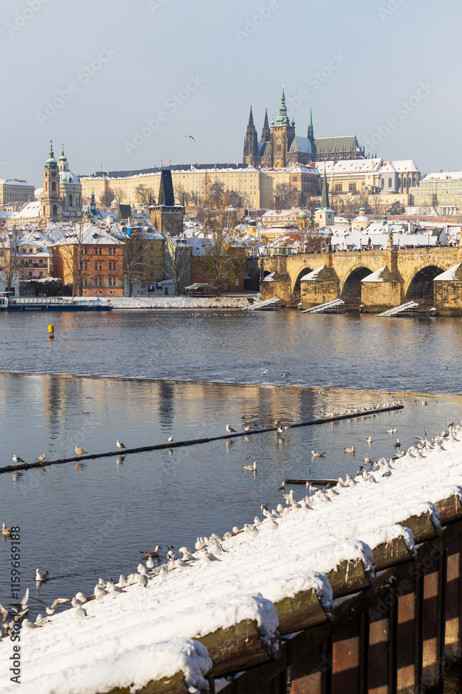 Snowy Prague Lesser Town with Prague Castle above River Vltava, Czech republic