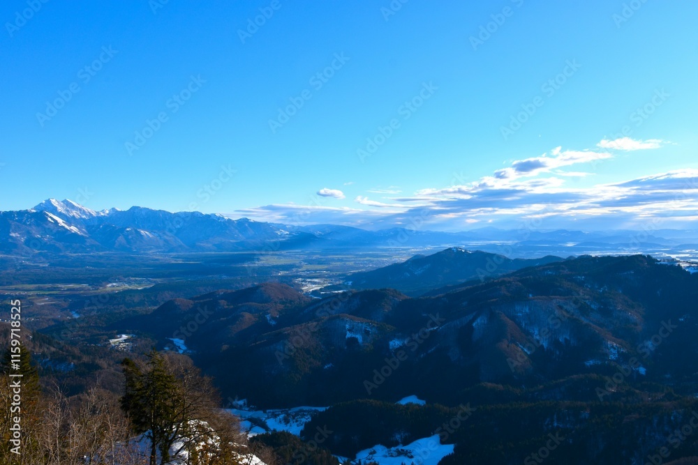Fototapeta premium View of forest covered hills and mountain in Gorenjska, Slovenia