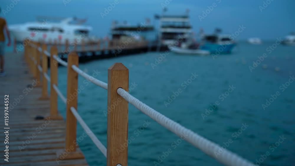 Empty wooden pier in cloudy weather near boat parking Empty wooden pier in cloudy weather near boat parking