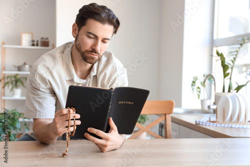 Religious man reading Bible...