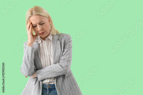 Worried mature businesswoma...
