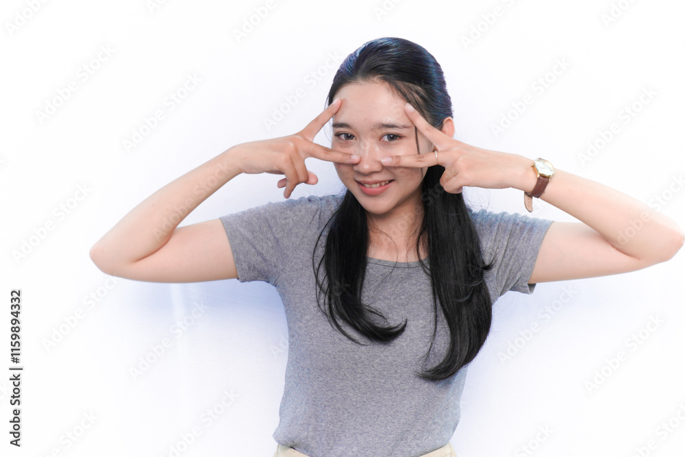 Asian Indonesian woman in grey dress smiling and expressing beautiful photo Asian Indonesian woman in grey dress smiling and expressing beautiful photo
