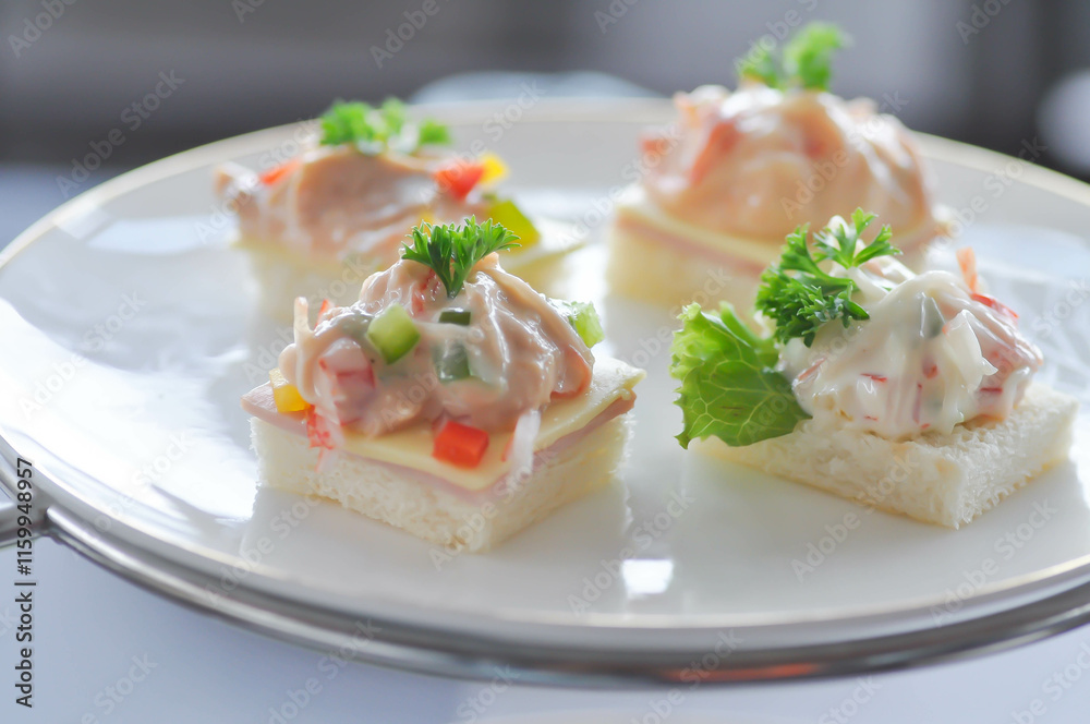 canape or toast with ham , cheese , crab stick and tuna canape or toast with ham , cheese , crab stick and tuna