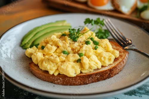 Freshly cooked scrambled eggs being served with toast and avocado, with a relaxed family breakfast atmosphere