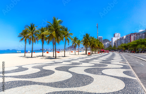 Copacabana beach with palms and famous sidewalk in Rio de Janeiro, Brazil photo