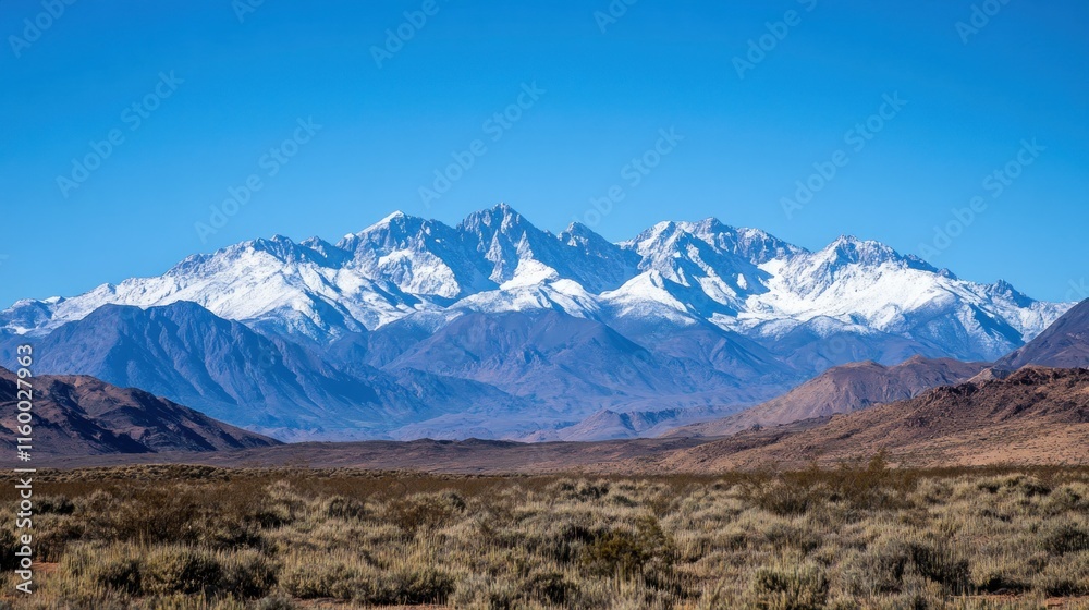 Snowy Mountain Range Under a Clear Blue Sky