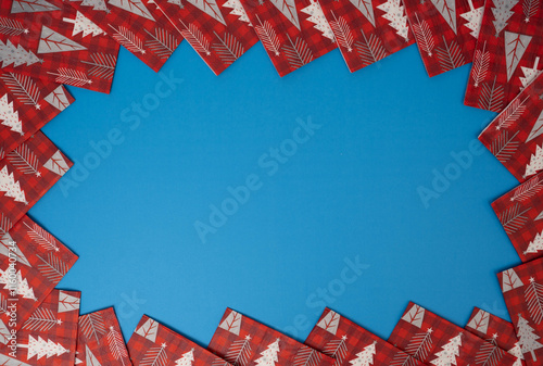 Merry Christmas and Happy Holidays greeting card, banner, frame . Background frame on blue red with white Christmas trees