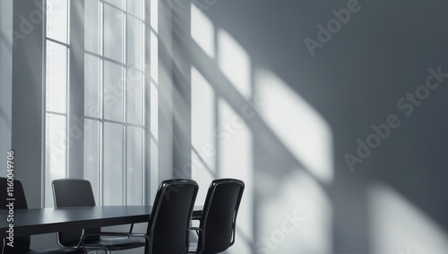Sunlit modern conference room with table and chairs.