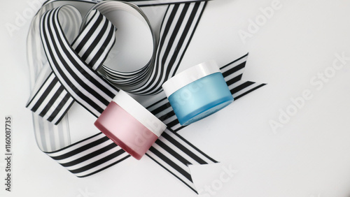 Skincare Products with Black and White Ribbon photo