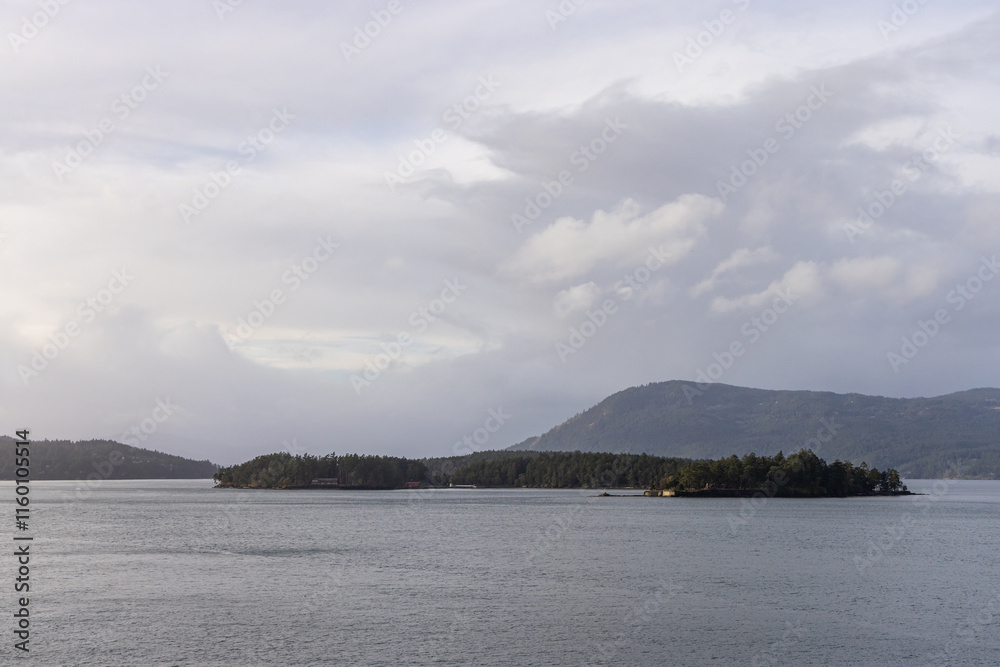Scenic View of Coastal Islands and Calm Waters Under a Cloudy Sky Scenic View of Coastal Islands and Calm Waters Under a Cloudy Sky