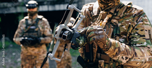 Soldier fpv operator attaches bomb to drone to strike enemy positions. Concept use of modern robot in military operations