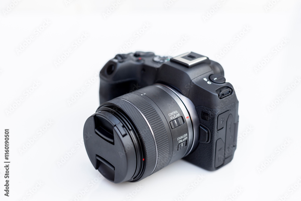 Fototapeta premium Mirrorless interchangeable lens digital full frame professional photo and video camera with lens.