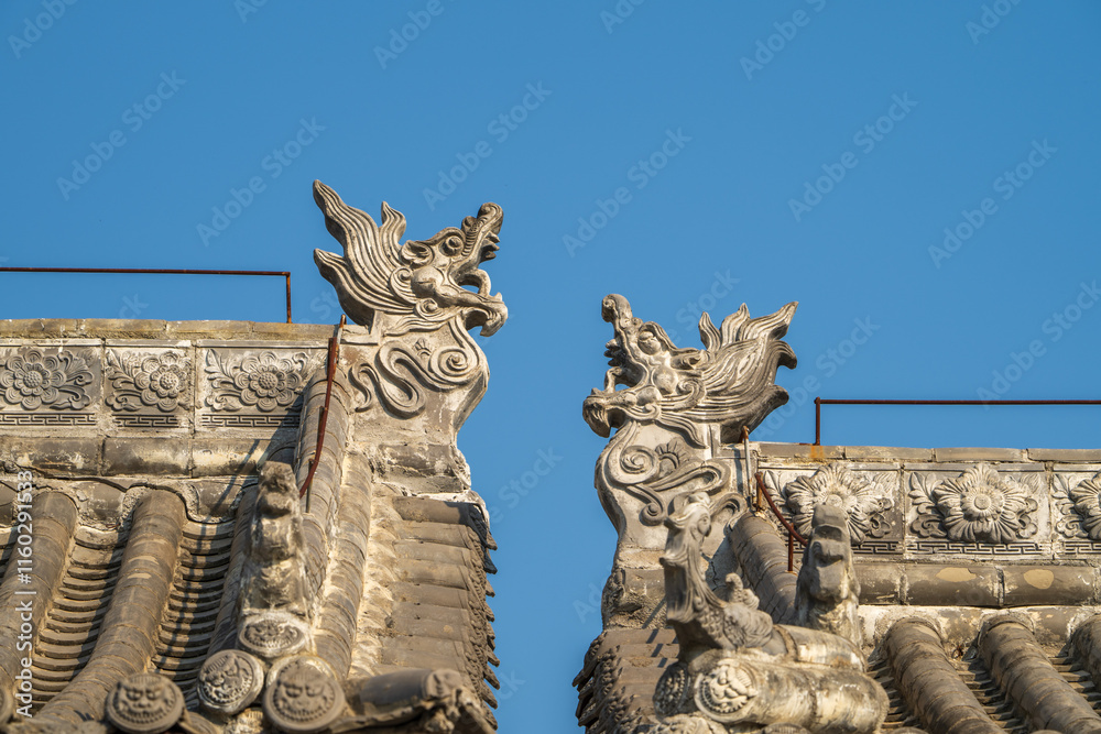 Fototapeta premium Roof carvings on traditional Chinese houses.