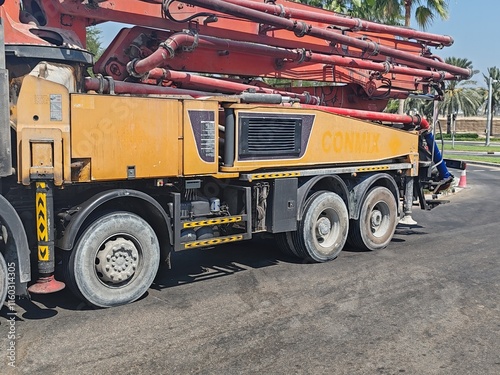 Concrete Pump Long Vehicle Used For Pumping Concrete From Ground To Roof Top Floor. Auto Concrete Pump Truck, Advanced Technology Remote Control Pump Used For Delivery Of Concrete From Mixture To Site