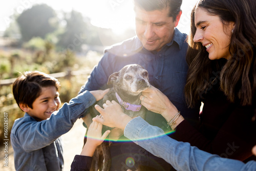 Little Graying Dog Getting Some Love From Family in San Diego photo