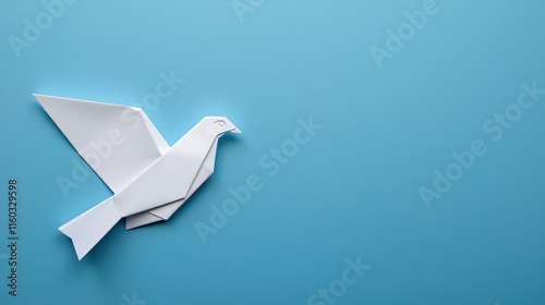 Minimalist origami dove on bright blue background.