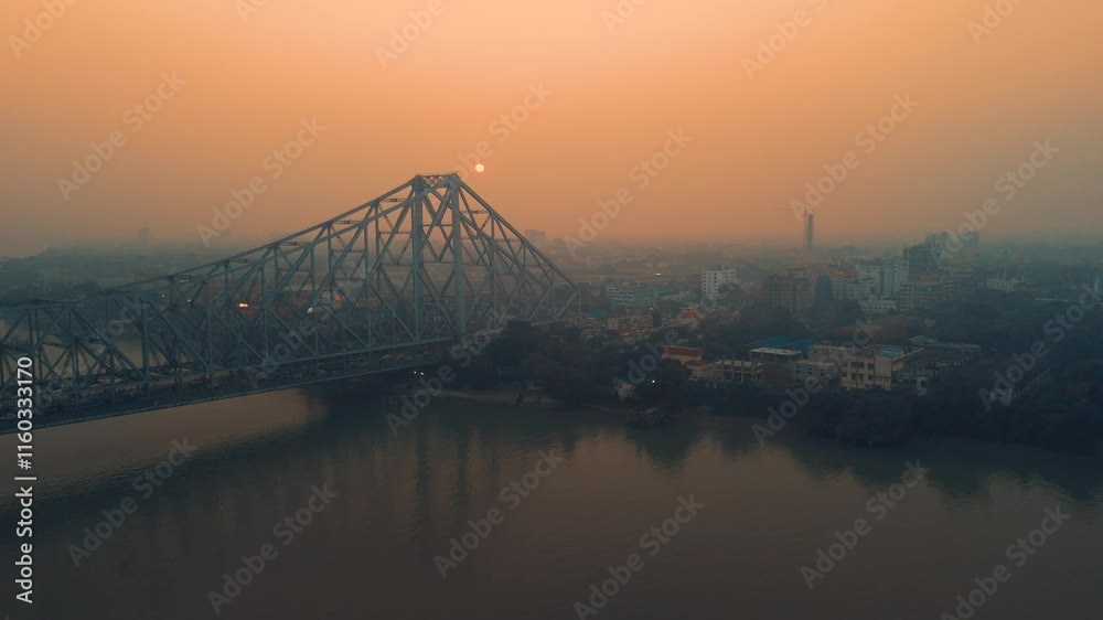 Aerial view of Kolkata Iconic Howrah Bridge or Rabindra Setu over Ganga River during Sunset