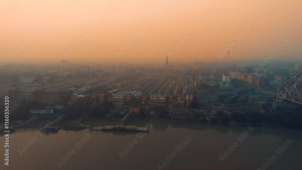 Arial View of Howrah station with Ganga River and Howrah Bridge during sunset