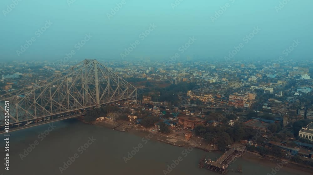 Aerial view of Kolkata Iconic Howrah Bridge or Rabindra setu over Ganga River during Winter Early Morning