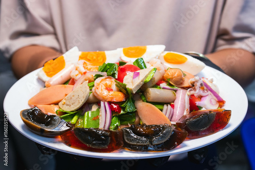 Papaya salad with preserved egg, salted egg, sausage, pork roll, salmon,  thai food, recommended thai food