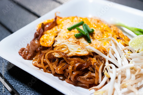 Korat stri fried noodle (Pad-Mee-Korat) in white plate.
