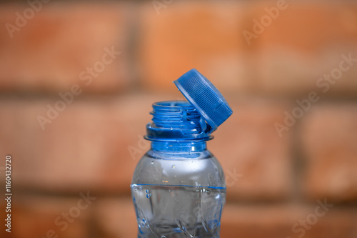 Macro close-up of a plastic bottle and the cork attached to it
