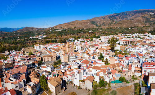 Orgiva town aerial panoramic view in Alpujarras, Spain photo