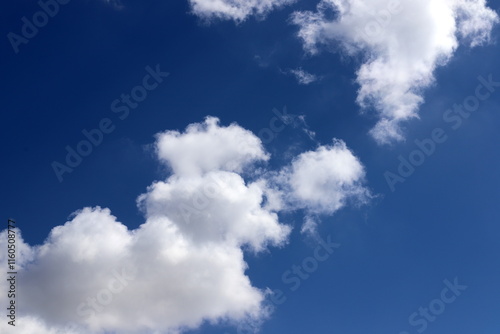 white clouds are floating across the sky