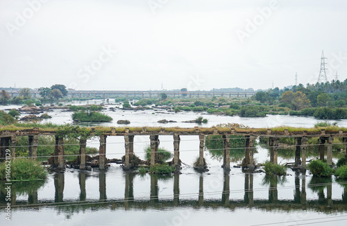 India, Karnataka, a Wellesley bridge over a body of water river cauveri photo