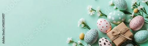 Easter banner template with Easter eggs and flower on light green background.Greetings and presents for Easter Day in flat lay styling. photo