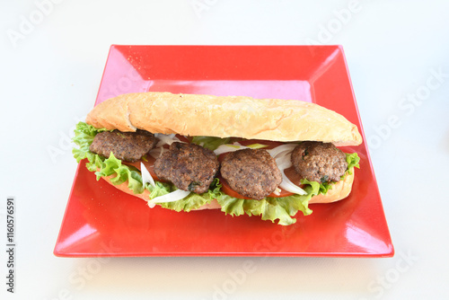 Meatball between bread (Turkish name : ekmek arasi kofte ) Izgara kofte. Manisa, Akcaabat, Akhisar  kofte. Delicious meat grilled meatballs. photo