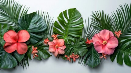 Tropical flowers and palm leaves creating a vibrant border on white background
