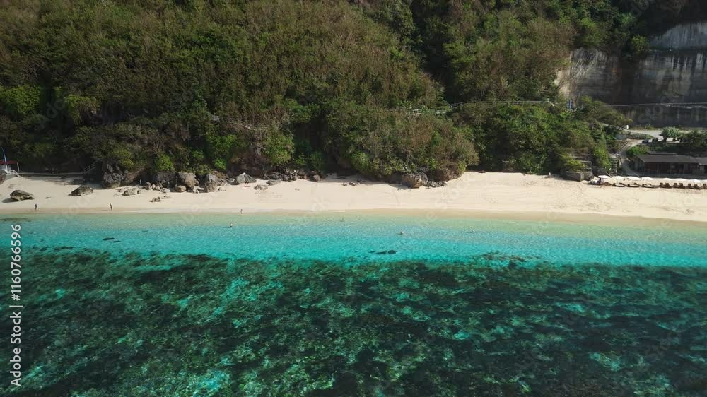 Coastline beach on a sunny day with quiet blue ocean. Aerial view Bali beach Coastline beach on a sunny day with quiet blue ocean. Aerial view Bali beach