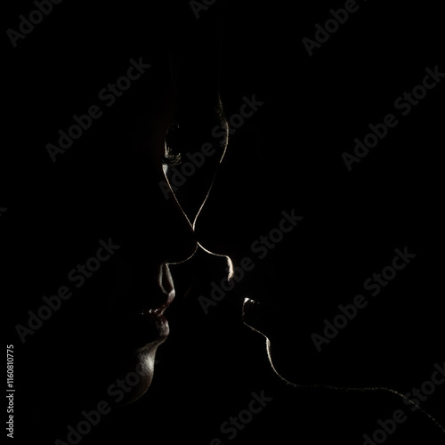 two girls kissing dark low key