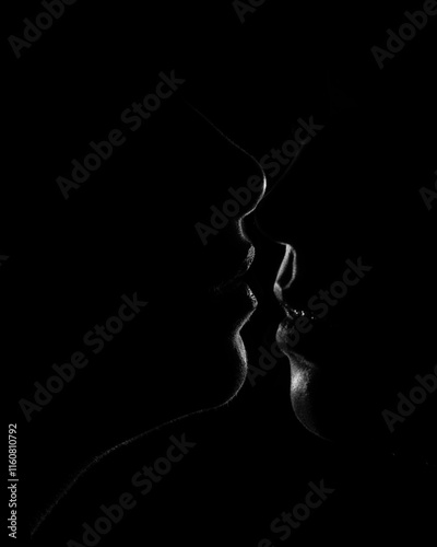 two girls kissing dark low key