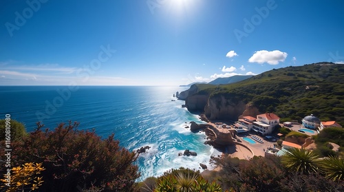 Coastal Paradise: Sun-drenched cliffs meet the azure Mediterranean, creating a breathtaking panorama of coastal beauty.  Picturesque buildings hug the shoreline.