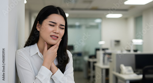 Woman Experiencing Throat Pain Office Setting White Shirt Background photo