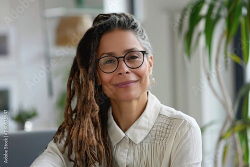 Confident woman with dreadlocks in professional office. photo