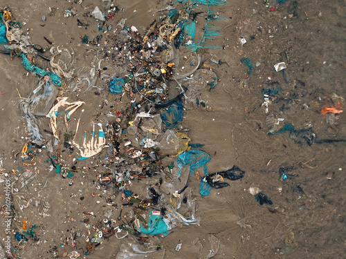 Pollution on the beach in Vietnam. Royalty high-quality free best stock of gabage, plastic, waste trash from the sea to make dirty beach. Waste that polluted the ocean environment, ecological prolem photo